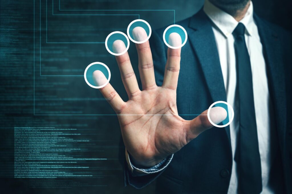 A person using hand geometry to access their accounts.