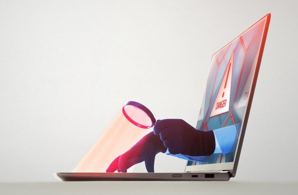 A fraudster looking at a persons data.