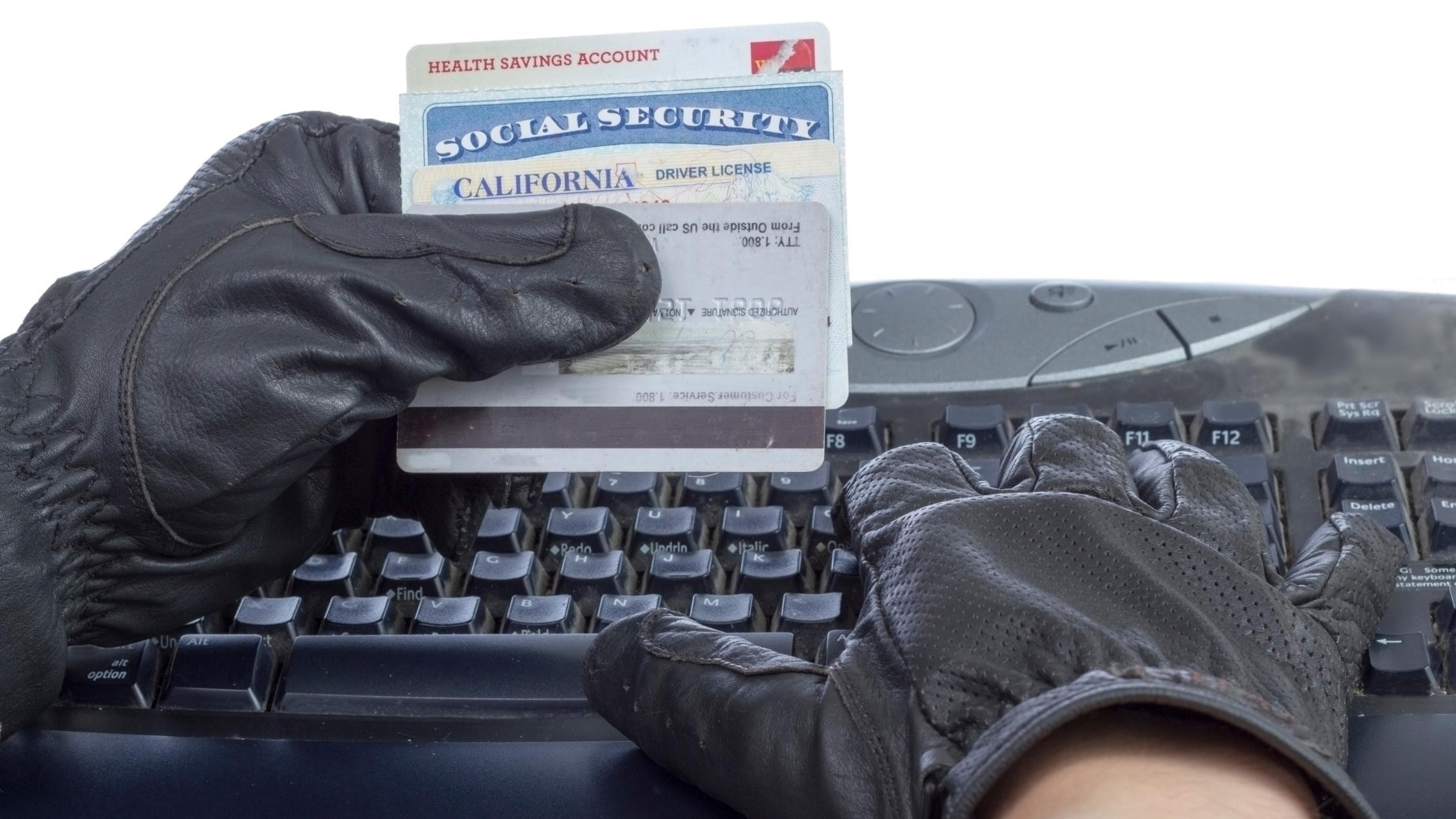 A fraudster attempting to steal the identity of another person.